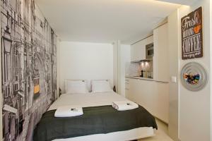 Cama o camas de una habitación en BmyGuest - Alfama Boutique Apartment