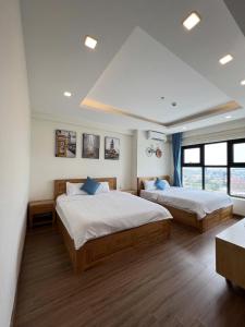 a large bedroom with two beds in it at FLC Sea Tower Quy Nhơn in Quy Nhon