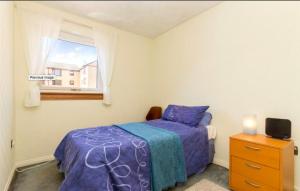 En eller flere senge i et værelse på Private room Glasgow