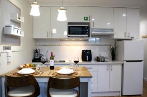 Kuchyň nebo kuchyňský kout v ubytování Sea Breeze Apartment