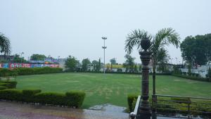 a street light in the middle of a park at Hotel Holiday Fun Resort in Prāgpura