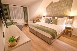 Ένα ή περισσότερα κρεβάτια σε δωμάτιο στο Amelie Apartments