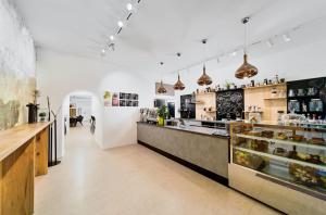 a large kitchen with a counter and a bakery at Beenie 5 in Linz