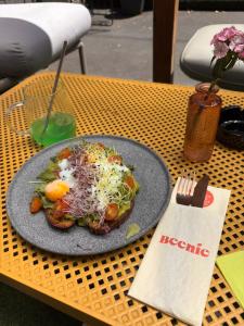 a plate of food sitting on a table at Beenie 5 in Linz +1 photo