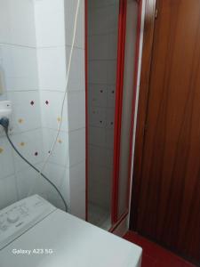 a bathroom with a shower and a toilet and a glass door at Colazione coccolosa in Melfa +22 photos