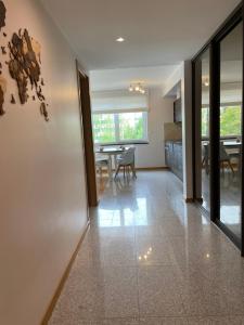 a living room with a table and a dining room at Suur-Jõe apartment in Pärnu