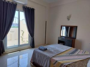 Postel nebo postele na pokoji v ubytování Nille and Garden View Apartment