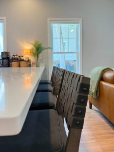 a living room with a table and a couch at Stylish Lake Getaway: Kayaks •Foosball •Ping Pong in Badin +54 photos