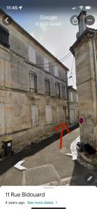 een oud gebouw met een rood lint ervoor bij #LeBlue #Centre Ville in Cognac