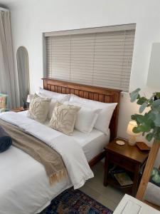 En eller flere senge i et værelse på The Bungalow 2 min walk to The Point