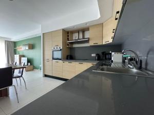 Η κουζίνα ή μικρή κουζίνα στο Bayview Seafront 5A