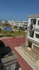 a view of a building with a park in the background at Malaga Beach in Mansouria