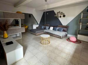 a living room with a couch and a table at La tava in Mamoudzou