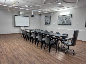 a conference room with a long table and chairs at Casa Chillax in Jodhpur