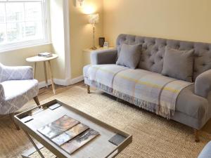 a living room with a couch and a coffee table at 33 Chapel Street in Penzance