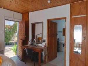 a bathroom with a vanity and a sink in a room at Lourette se Plek in Sannieshof