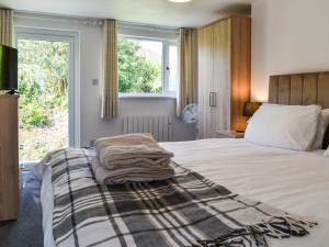 a bedroom with a bed with a blanket on it at 2 Le Dorney Villa - Uk49804 in Par