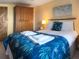 En eller flere senge i et værelse på Derwent Cottage - Uk49220