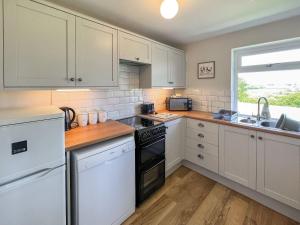 Η κουζίνα ή μικρή κουζίνα στο Jasmine Apartment - Uk49309