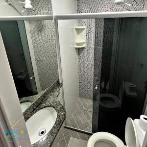 a bathroom with a toilet and a sink and a shower at Pousada Amigos do Caetés in Angra dos Reis +56 photos