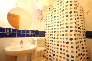 a bathroom with a sink and a shower curtain at Restingolita in La Restinga +24 photos