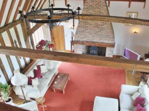 an overhead view of a living room with a fireplace at Doves Barn in Needham Market