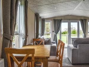 a living room with a table and a couch at Bentley - Uk49383 in Sewerby