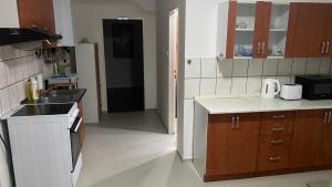a kitchen with a sink and a counter top at Green house in Rožňava