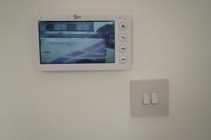 a nintendo wii game system with a video screen at Concept Rooms 6 Central Enfield Town Station in Enfield