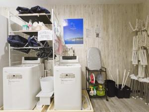 a room with refrigerators and other items on a wall at Sea Style Resort OCEAN in Karatsu +42 photos
