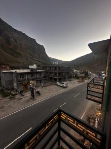 a view from a balcony of a road and buildings at Glampfire Hotel and Cafe in Jispa