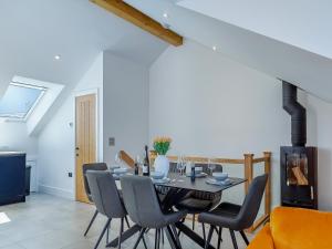 a dining room with a table and chairs at Sea Skapya - Uk50178 in Helston