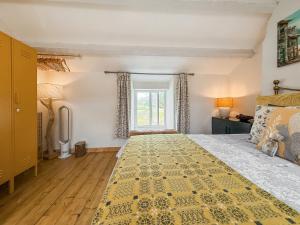 Postel nebo postele na pokoji v ubytování Tegfryn Cottage + 9 fotografií