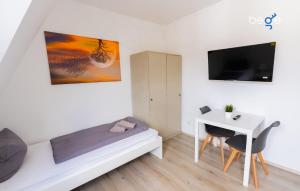 Μια τηλεόραση ή/και κέντρο ψυχαγωγίας στο BEGE APARTMENTS CrewLodge