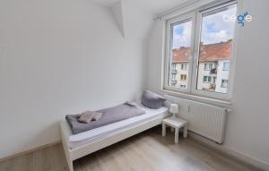 Ένα ή περισσότερα κρεβάτια σε δωμάτιο στο BEGE APARTMENTS CrewLodge