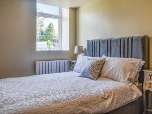 Ένα ή περισσότερα κρεβάτια σε δωμάτιο στο Brun Cottage