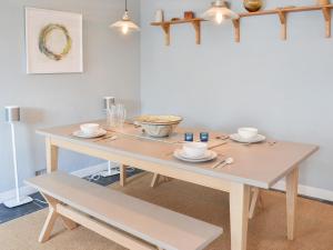 a table with cups and saucers on it at 33 Chapel Street in Penzance +24 photos