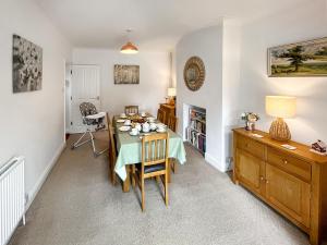 a dining room with a table and chairs at Rosemary House in Broadstairs