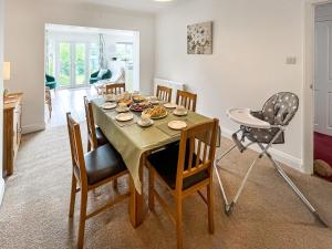 a dining room with a table and chairs at Rosemary House in Broadstairs