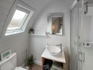 a bathroom with a sink and a shower at Lotties Lodge - Uk49905  +3 photos