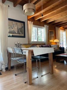 a dining room with a table and some chairs at Large Riverside Chalet Near Gorges du Verdon in La Bastide