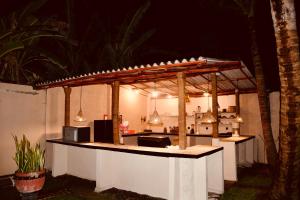 an outdoor kitchen with a counter top with at Eolie Weligama in Weligama
