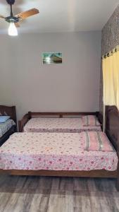 a bedroom with a bed in a room at Pousada Rancho Dona Lú Comfort in Pereira Barreto