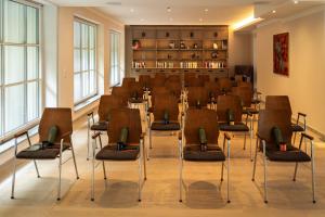 a large room with chairs in a waiting room at MedVital Gesundheitsresidenz Tegernsee in Tegernsee