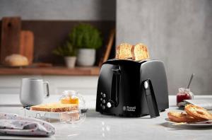 a toaster is sitting on a counter with bread at LianHome b&b "Volte" in Lucera