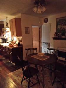 a kitchen and dining room with a table and chairs at Cozy 2 Bedroom Home in Madison