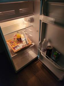 an open refrigerator with food and drinks in it at RiverVio Bed & Breakfast in Upington