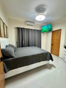 Postel nebo postele na pokoji v ubytování Your ideal escape in Puerto Plata Beach and fun