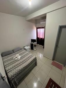 Ένα ή περισσότερα κρεβάτια σε δωμάτιο στο Pousada santos +4 φωτογραφίες