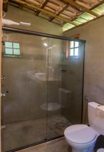 a glass shower in a bathroom with a toilet at Akasha Atelier Sana in Sana +76 photos